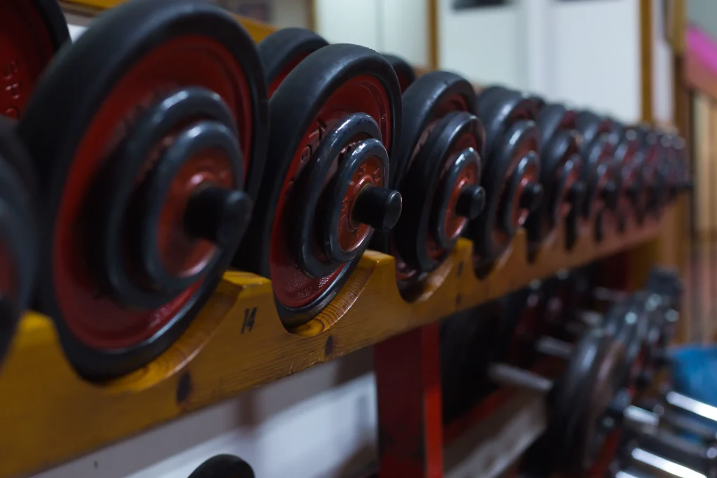 red dumbbells home gym equipment