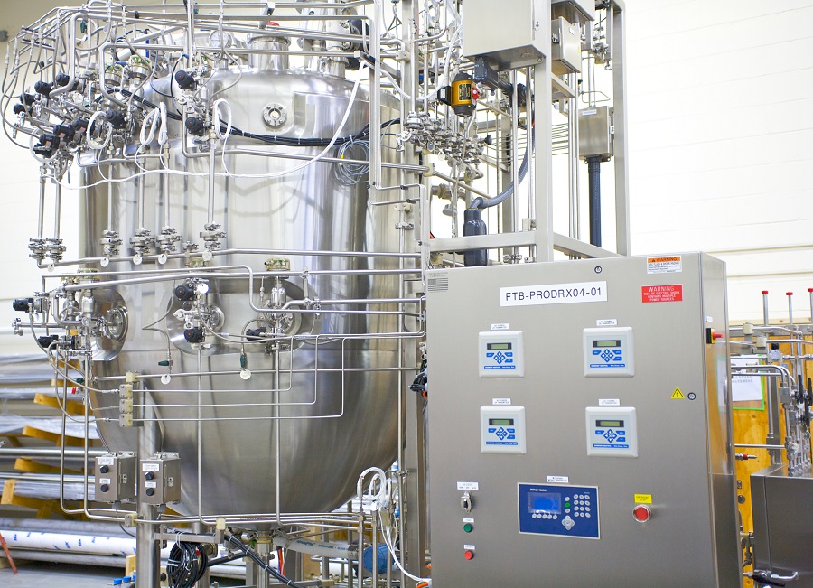 Stainless steel bioreactor and fermentation skids in a process facility